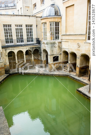 The Roman Baths, surrounded by honey-colored stone buildings, in Bath, a UNESCO World Heritage site in the UK. The Roman Baths, surrounded by honey-colored stone buildings, in Bath, a UNESCO World Heritage site in the UK. 143528677