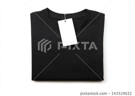Neatly folded black sweater with a tag on a clean white background Neatly folded black sweater with a tag on a clean white background 143529032