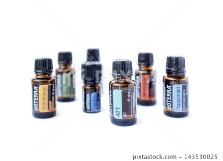 Essential oil bottles arranged in a creative display, showcasing various scents and colors, emphasizing natural wellness and aromatherapy benefits for holistic health Essential oil bottles arranged in a creative display, showcasing various scents and colors, emphasizing natural wellness and aromatherapy benefits for holistic health 143530025