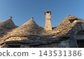 Traditional Trulli Conical Roofs in Alberobello Puglia Italy Under Blue Sky 143531386