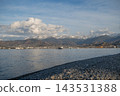 Batumi Pebble Beach with Fishing Boats and Seagulls by Caucasus Mountains 143531388