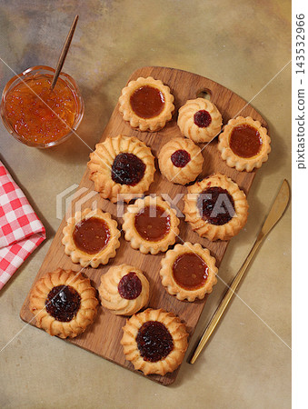 Freshly baked homemade shortbread cookies with jam and preserves on concrete background, modern bakery and grain based product concept. Healthy breakfast with ingredients, cafe and restaurant menu, 143532966