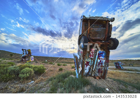 Abandoned Vehicles Standing in Desert with Graffiti at International Car Forest 143533028