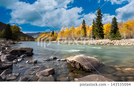 Serene Autumn River Landscape in Tibet with Golden Trees and Rocky Shoreline Serene Autumn River Landscape in Tibet with Golden Trees and Rocky Shoreline 143535094
