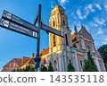Historic Church and Directional Signpost in Vilnius, Lithuania 143535118