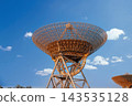 Large Parabolic Radio Telescope Antenna Against Clear Blue Sky 143535128