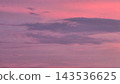 A blurred pink and purple sunset sky creates a soft, dreamy gradient background 143536625