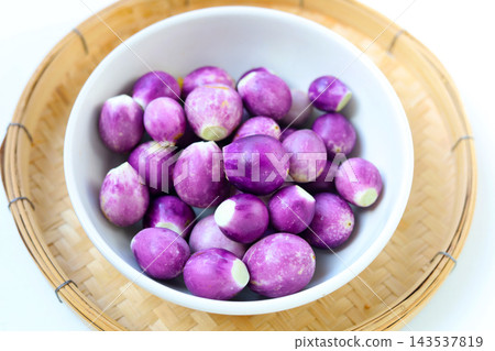 Fresh small purple eggplants arranged for cooking Fresh small purple eggplants arranged for cooking 143537819