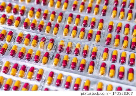 Antibiotic capsule pills in blister pack at production line of pharmaceutical manufacturing factory. Pharmaceutical industry and pharmaceutics concept. Antibiotic drug resistance. Pills packaging. 143538367