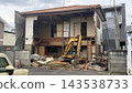 Old wooden house being demolished 143538733