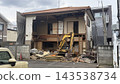 Old wooden house being demolished 143538734