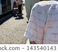 A line of elderly people waiting to board the bus 143540143