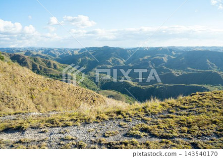 A breathtaking panoramic view of rolling hills on Sumba Island, Indonesia. A breathtaking panoramic view of rolling hills on Sumba Island, Indonesia. 143540170