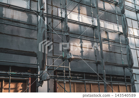A renovation construction site bathed in sunlight. A renovation construction site bathed in sunlight. 143540589