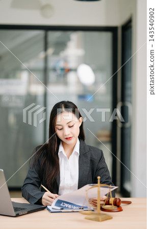 Beautiful asian woman lawyer working and gavel, tablet, laptop in front, Advice justice Beautiful asian woman lawyer working and gavel, tablet, laptop in front, Advice justice 143540902