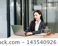 Beautiful asian woman lawyer working and gavel, tablet, laptop in front, Advice justice Beautiful asian woman lawyer working and gavel, tablet, laptop in front, Advice justice 143540926
