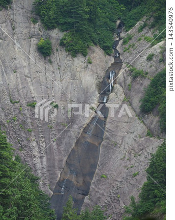 Akita Prefecture - Kyukai Falls: A long, narrow waterfall that cascades down a sheer cliff face in multiple stages. Akita Prefecture - Kyukai Falls: A long, narrow waterfall that cascades down a sheer cliff face in multiple stages. 143540976