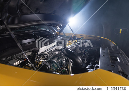 Car engine hood open, auto repair shop, close-up 143541788