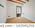Empty room with wooden beams and a large window. Light-colored wooden floor. Minimalist design with white walls. Ideal for interior design concepts. 143545258