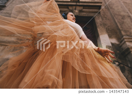 Woman Dancing with Headphones in Historic City Woman Dancing with Headphones in Historic City 143547143