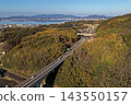 An aerial photograph overlooking the elevated highway bridge on the shores of Lake Shinji in Matsue City, Shimane Prefecture. 143550157