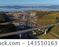 An aerial photograph overlooking the elevated roads around Tamatsukuri Onsen in Matsue City, Shimane Prefecture, and Lake Shinji. 143550163