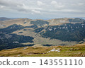 Beautiful nature in mountain on a cloudy day. hiking environment with rock and grass on the hills 143551110