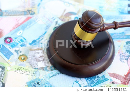 Bahraini dinar currency money bills and wooden judge mallet. The concept of judgment or auction 143551281