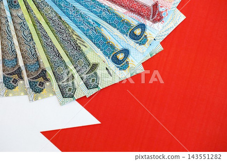Bahraini dinar currency money bills lies on flag. The concept of business and investment 143551282