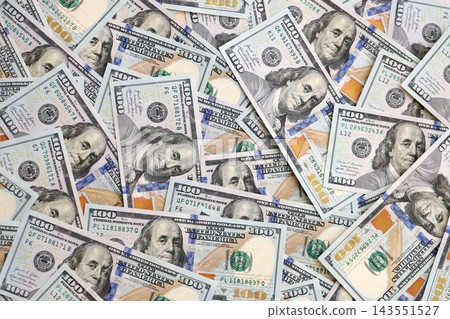 Stack of dollars and cash with a money background. US money and banknotes Stack of dollars and cash with a money background. US money and banknotes 143551527