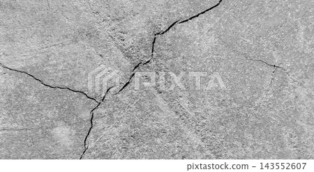 Cracked concrete wall texture background with crisscross pattern Cracked concrete wall texture background with crisscross pattern 143552607