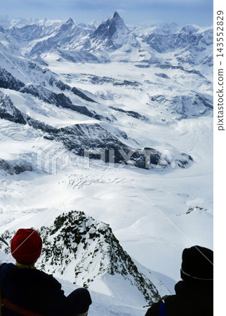 Panoramic View from a Mountain Peak with Snow-Capped Alps Panoramic View from a Mountain Peak with Snow-Capped Alps 143552829