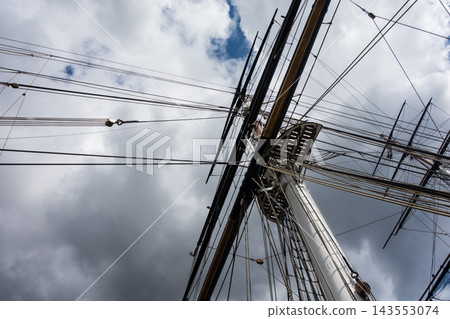 The mast of the historic sailing ship Cutty Sark in Greenwich, East London, under the bright sunlight. The mast of the historic sailing ship Cutty Sark in Greenwich, East London, under the bright sunlight. 143553074