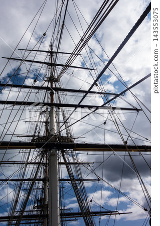 The mast of the historic sailing ship Cutty Sark in Greenwich, East London, under the bright sunlight. The mast of the historic sailing ship Cutty Sark in Greenwich, East London, under the bright sunlight. 143553075