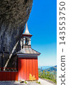 The historic wooden cliff chapel of Wildkirchli built into a mountain cave in the Alpstein region, Switzerland 143553750