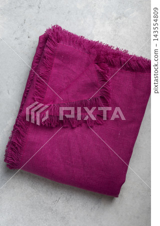 Folded Fuchsia Pink Fringed Linen Tablecloth Flat Lay Folded Fuchsia Pink Fringed Linen Tablecloth Flat Lay 143554809