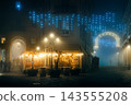 Foggy night in old town of Asti, Italy, with Christmas lights and outdoor restaurant. 143555208