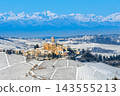 A medieval village on the hill and snow-covered vineyards against backdrop of the snow-capped Alps. 143555213
