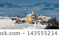 Small italian town on the snowy hill. 143555214