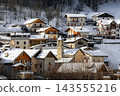 Stone houses covered with snow in the small town of Pietraporzio, in Piedmont, Italy 143555216