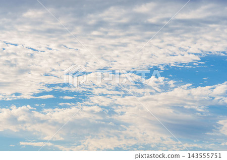 Close-up 33 of a summer evening landscape featuring a blue sky and expansive clouds. Close-up 33 of a summer evening landscape featuring a blue sky and expansive clouds. 143555751