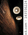 Brick wall lit up at night 143556224