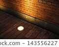 Lights reflected on the brick wall 143556227