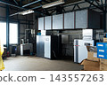A factory scene with machinery. Manufacturing, industry, warehouse, air conditioning, air conditioner, compressor, inverter, equipment, machinery. 143557263