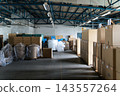 Warehouse scene. Logistics, goods, cargo, factory, logistics center, inventory, wholesale, cardboard boxes, stock, supplies, unmanned. 143557264