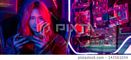 woman live stream she play video game at home neon lights living room 143561034