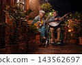 Senior couple enjoying peaceful evening together with dog on terrace. 143562697