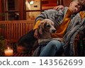 Senior couple enjoying peaceful evening together with dog on terrace. 143562699