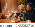 Loving senior couple enjoying romantic evening together on terrace. 143562710