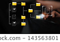 Abstract representation of digital file organization and data management with folders, documents, and hands typing on a keyboard in a modern workspace Gluon 143563801